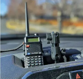  ??  ?? Left: Most vehicles offer spots, such as cup holders or storage, for handheld radios. The perfect spot allows for easy listening and a quick grab when a response is needed.