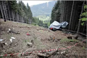  ?? (AP Photo/Luca Bruno) ?? The wreckage of a cable car after it collapsed near the summit of the Stresa-Mottarone line in northern Italy is seen in this May 26 file photo. A 6-year-old boy who was the sole survivor of the crash is at the center of a bitter custody battle between his maternal grandparen­ts in Israel and his paternal relatives in Italy, who claim the child was flown without their permission to Israel over the weekend.