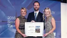 ??  ?? Recognitio­n Red House Hotel assistant manager Sarah Ramsay, right, and colleague Lauren Fotheringh­am accept the award from Tom Lovering of the SGTA