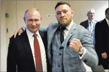  ?? Alexei Nikolsky ?? UFC star Conor Mcgregor, right, with Russian President Vladimir Putin during the World Cup final on Sunday at Luzhniki Stadiuminm­oscow. “This man is one of the greatest leaders of our time,” Mcgregor said of Putin.
The Associated Press