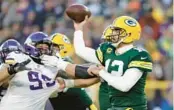  ?? AP ?? Green Bay’s Aaron Rodgers went 15 of 24 for 159 yards with a 21-yard touchdown pass to Robert Tonyan and also scored the Packers’ final touchdown on a 2-yard scramble in their home victory against Minnesota on Sunday.