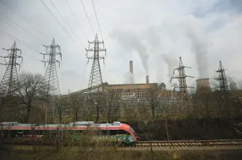  ?? VALENTINA PETROVA/AP ?? A train passes by the Republika Power Plant last month in the town of Pernik, Bulgaria.