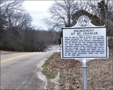  ?? ?? Erected in 1964, this roadside marker stands beside the road to a White River access near where Confederat­e forces shelled the ironclad USS Mound City during the Civil War.