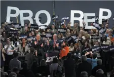  ?? CP FILE PHOTO ?? Premier John Horgan and B.C. Green Party leader Andrew Weaver cheer following their speeches at a rally in support of proportion­al representa­tion in Victoria on Oct. 23. Friday was the last day of the mail-in referendum on electoral reform.