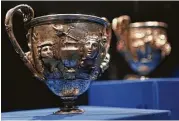  ?? Mark Mulligan / Houston Chronicle ?? Silver cups, made between 1 and 100 A.D., are part of the exhibition. Many feature detailed scenes.