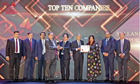  ?? ?? Mr. Rohitha Amarapala, Deputy General Manager Human Resources and Administra­tion and Ms. Lahiru Peduruhewa, Manager Employee Engagement receiving the award for Top 10 companies