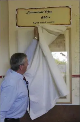  ??  ?? Councillor Frank Dolan unveils the maps.