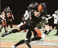  ?? Pete Paguaga / Hearst Connecticu­t ?? Shelton’s Trevor Kiman dives to catch a pass during a football game between Shelton and Xavier at Finn Stadium, Shelton on Tuesday.