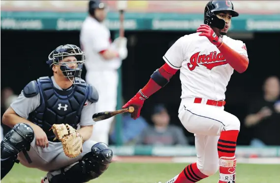 ?? TONY DEJAK/THE ASSOCIATED PRESS ?? Cleveland second baseman Francisco Lindor connects for a two-run double off Detroit Tigers starter Michael Fulmer Thursday in Cleveland’s 9-3 win.