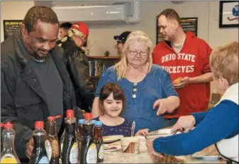  ?? JESI YOST - DIGITAL FIRST MEDIA ?? Veterans and their families line up for a pancake breakfast at Veterans Making A Difference, held in the bottom floor of the Hope Rescue Mission in Reading.