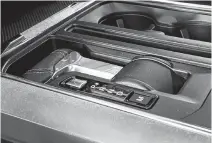  ?? JIL MCINTOSH • POSTMEDIA NEWS ?? The 2021 F-150’s gearshift lever folds so a tray can be flipped over it for work or lunch.