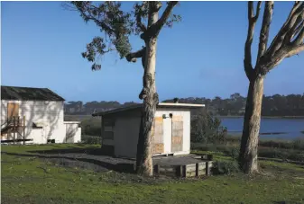  ?? Gabrielle Lurie / The Chronicle 2016 ?? Boarded-up buildings are all that remains of the Pacific Rod and Gun Club, which ended its 81-year run at Lake Merced when San Francisco terminated its lease in April 2015.