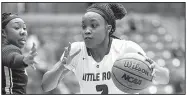  ?? Arkansas Democrat-Gazette/THOMAS METTHE ?? Terrion Moore (above) and Tori Lasker combined to contribute 19.8 points per game as UALR posted a 15-3 Sun Belt Conference record, but the Trojans needed time to weave them into games together.