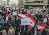  ?? EPA ?? Lebanese activists carry banners reading ‘We will not pay the price’ during a protest on Saturday