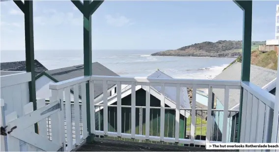  ??  ?? > The hut overlooks Rotherslad­e beach