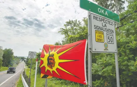  ?? RYAN REMIORZ / THE CANADIAN PRESS ?? Tension continues at the border of the Kanesatake Mohawk territory and the town of Oka over a developer’s plan to return land to the Mohawks.