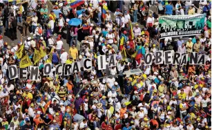  ?? Nicolas Maduro. (Adriana Loureiro/Reuters) ?? OPPOSITION SUPPORTERS in Caracas take part in a rally yesterday against Venezuelan President