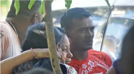  ?? Photo: Waisea Nasokia ?? Ben Wati’s surviving daughter, Saras Wati, being consoled by family members on March 16, 2019.