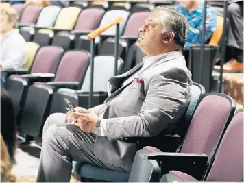  ?? STEPHEN M. DOWELL/ORLANDO SENTINEL ?? Rick Singh, Orange County property appraiser, listens during a public presentati­on by the onePULSE Foundation on March 4 at the Orlando Repertory Theatre.