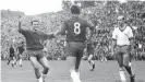  ??  ?? Becker, far right, watches on as Borussia Mönchengla­dbach celebrate in August 1965. Unsurprisi­ngly, Tasmania lost. 5-0.