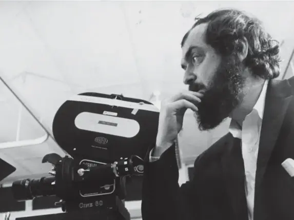  ?? (Getty) ?? Filmmaker and innovator Kubrick stands beside a camera in March 1975