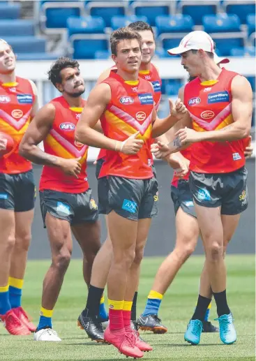  ?? Picture: AAP IMAGE ?? READY TO RISE: Cairns junior Jacob Heron trains with his Gold Coast Suns teammates at Jiangwan Stadium in Shanghai, China, ahead of his AFL debut today.