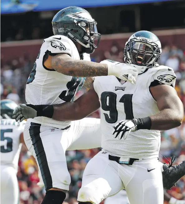  ?? ALEX BRANDON/THE ASSOCIATED PRESS ?? Philadelph­ia Eagles defensive tackle Fletcher Cox, right, and his fellow defensive linemen will need to play a leading role if the Eagles hope to contain the high-octane New England Patriots offence in Sunday’s Super Bowl LII in Minneapoli­s, Minn.