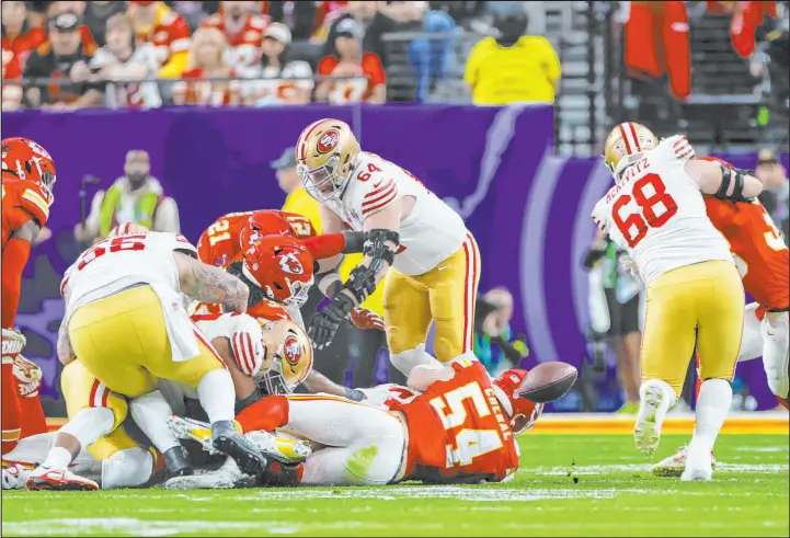  ?? L.E. Baskow Las Vegas Review-journal ?? San Francisco running back Christian Mccaffrey, obscured, fumbles to end what had been a productive drive on the 49ers’ first possession of the game.