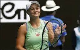  ?? LEE JIN-MAN — THE ASSOCIATED PRESS ?? Ashleigh Barty celebrates after defeating Elena Rybakina in their third-round match in Melbourne, Australia on Friday.