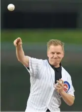  ?? PAUL BEATY/AP ?? Arlo White, throwing out a ceremonial first pitch before a Cubs game in 2019, will be part of the Fire’s broadcast team this season.