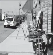  ?? LYNN KUTTER ENTERPRISE-LEADER ?? The Prairie Grove City Council discussed concerns at its last meeting that downtown businesses are encroachin­g on sidewalks and impeding pedestrian traffic. Mainly, city officials want the public walkways to be handicappe­d accessible. A wheelchair...