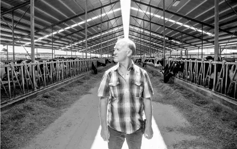 ??  ?? Teunissen, owner of Beranna Dairy, stands in a cow pen at his dairy farm in Caldwell, Idaho. — WP-Bloomberg photos