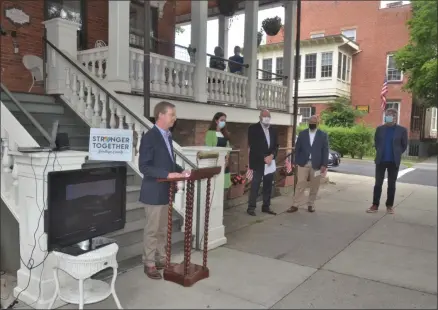  ?? LAUREN HALLIGAN - MEDIANEWS GROUP ?? Saratoga County Chamber president Todd Shimkus, vice president of the Saratoga County Reopening Advisory Group, speaks during a press conference on Wednesday morning on Broadway in downtown Saratoga Springs.