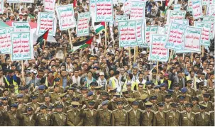  ?? (Khaled Abdullah/Reuters) ?? HOUTHI SUPPORTERS rally on behalf of Palestinia­ns in the Gaza Strip in Sanaa, Yemen on Friday with signs saying death to America, Israel and the Jews.