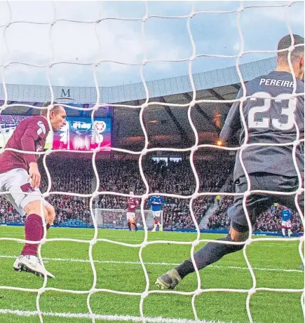  ?? Picture: SNS. ?? Alfredo Morelos, top, slams the ball home to make it 3-0 to Rangers.