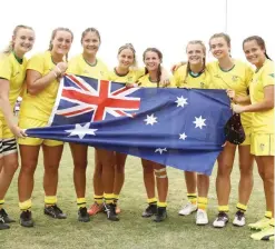  ?? — AFP ?? NASSAU: The Australia girls team celebrate victory in the Girl’s Rugby 7’s Gold medal Final on day 4 of the 2017 Youth Commonweal­th Games at QE Sports Centre on Friday in Nassau, Bahamas.