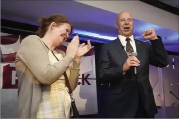  ?? CAROLYN KASTER — THE ASSOCIATED PRESS ?? State Sen. Doug Mastriano, R-Franklin, a Republican candidate for Pennsylvan­ia governor, gestures as he speaks at a primary night election gathering in Chambersbu­rg, Pa., Tuesday with his wife, Rebbeca.