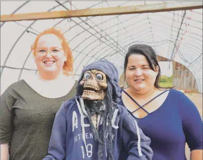  ?? COLIN MACLEAN/JOURNAL PIONEER ?? Monica Kani and Reasha Walsh of Summerside’s Spotlight School of Arts Inc. are shown with one of many props the group inherited from the now closed Lowther’s Haunted Farm. Spotlight has partnered with Kool Breeze Farms and community groups to bring...