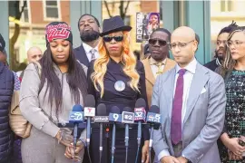  ?? ASHLEE REZIN /CHICAGO SUN-TIMES VIA AP ?? Flanked by family members, attorneys and supporters, Dexter Reed’s mother, Nicole Banks, speaks to reporters outside the headquarte­rs for the Civilian Office of Police Accountabi­lity in West Town, Chicago, on Tuesday.