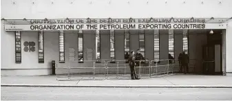  ?? Getty Images file photo ?? Police guard the entrance to OPEC headquarte­rs in Vienna in 2017. The group and its partners cut output this year when global lockdowns inflicted the biggest oil demand collapse in history.