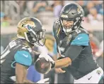  ?? Getty Images ?? BLAKE BITTEN: Jaguars quarterbac­k Blake Bortles, handing the ball off, continues to play poorly and could lose his starting job to Chad Henne.