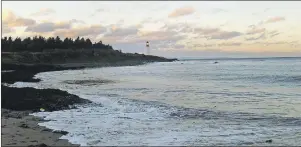  ??  ?? Pictured above is the Low Point Lighthouse which is being preserved at present with funding from the federal government. The photo was taken from the beach at the bottom of Brown Street in New Victoria.