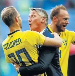  ?? Picture: REUTERS ?? GREAT BALLS OF FIRE: Top: Sweden's Ola Toivonen celebrates victory with a member of the coaching staff after the match Bottom: Sweden fans in high spirits at the Saint Petersburg Stadium yesterday.