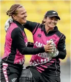  ?? PHOTOSPORT ?? White Ferns pace bowler Lea Tahuhu and wicketkeep­er Katey Martin celebrate a wicket.