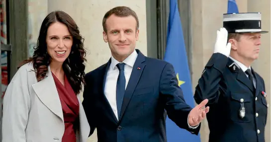  ?? PHOTO: AP ?? New Zealand’s Prime Minister Jacinda Ardern is welcomed by French President Emmanuel Macron at the Elysee Palace in Paris.