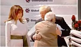  ?? — PTI ?? Prime Minister Narendra Modi greets US President Donald Trump with a hug as First Lady Melania Trump smiles, upon their arrival at the Sardar Vallabhbha­i Patel Internatio­nal Airport in Ahmedabad on Monday.