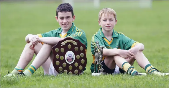  ??  ?? Captain Jack O’Keeffe and Rian Quinn Man of the Match for Moyvane after they defeated Ballyduff in the North Kerry Tommy Madden Memorial U13 Championsh­ip final played in Coolard on Sunday morning Photo by John Stack