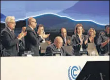  ?? REUTERS ?? Delegates applaud after COP27 president Sameh Shoukry’s statement at the closing plenary in Egypt on Sunday.