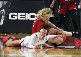  ?? MARY SCHWALM ?? Boston College’s Clara Ford ( 32) reacts as she battles for the ball on the floor with North Carolina State’s Elissa Cunane ( 33) during the second half of an NCAA college basketball game, Sunday, Dec. 13, 2020, in Boston.
