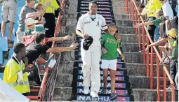  ?? /DUIF DU TOIT / GALLO IMAGES ?? Makhaya Ntini and his son Thando lead out the SA team in his 100th test in 2009.